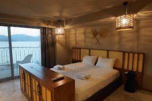 Postel nebo postele na pokoji v ubytování Icon Beach Suites Hotel Sovalye Island