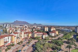 an aerial view of a city with mountains in the background at Manhattan Towers 506 by CTHA in Cape Town
