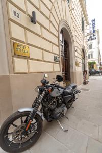 a motorcycle parked in front of a building at Adventor Eco-Suites in Rome