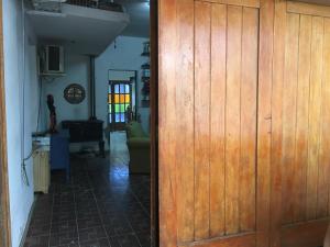 a wooden door in a room with a hallway at Residencia La Isabel in San Luis