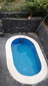 a swimming pool in the middle of a yard at Costa Este House in Monte de Breña