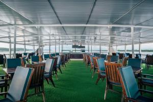 a group of chairs and tables on a boat at Grand Amazon Expedition in Manaus