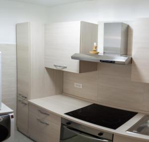 a kitchen with a sink and a stove top oven at Residenza Cotruta Spiazzo in Spiazzo +1 photo