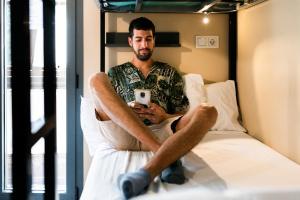 Postel nebo postele na pokoji v ubytování Hostel Carlota Braun