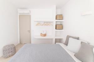 Postel nebo postele na pokoji v ubytování CAMPO SUITES