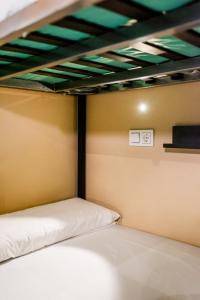Postel nebo postele na pokoji v ubytování Hostel Carlota Braun