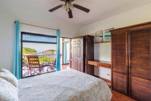 a bedroom with a bed and a view of the ocean at Ocotal Beach Front Condo #38 in Ocotal