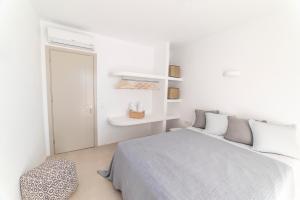 Postel nebo postele na pokoji v ubytování CAMPO SUITES