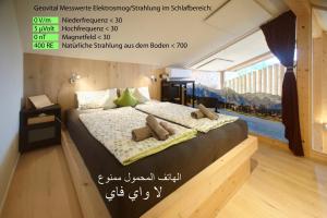 a poster of a bedroom with a bed with a train on it at Bio Ferienwohnung am Wildsee in Seefeld in Seefeld in Tirol