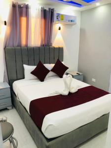 Postel nebo postele na pokoji v ubytování Hotel Reloj