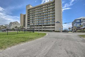 an empty street in front of a large building at North Myrtle Beach Oceanfront Condo with Pool! in Myrtle Beach