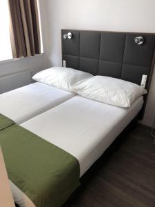 מיטה או מיטות בחדר ב-Apartment Philip Vienna Self Check-In