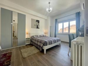 a bedroom with a bed and a large window at Dreamsrome Lux in Rome