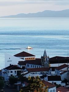 a small town with a church and the water at MAGMA RRAL3529 in Velas