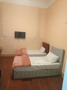 A bed or beds in a room at new one hotel