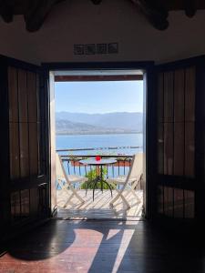 an open door to a patio with a table and chairs at Escape to History in a Stunning Stone House with Garden and Sea View in the Heart of Alanya in Alanya