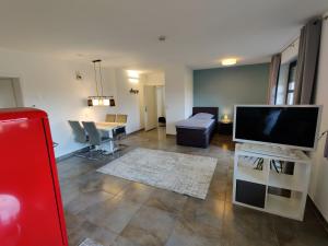 a living room with a flat screen tv and a couch at Haus Wehner in Stadtoldendorf