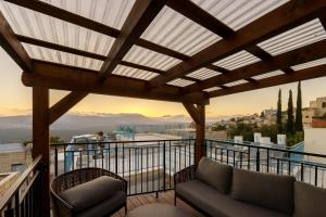 a balcony with a view of a city at שירת צפת in Safed
