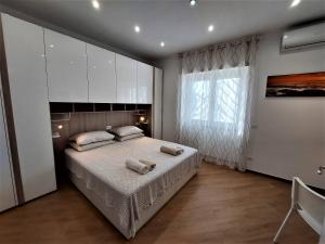 Posteľ alebo postele v izbe v ubytovaní TrustEverVito