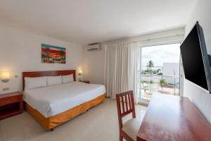 Letto o letti in una camera di Hotel Dos Playas Faranda Cancún