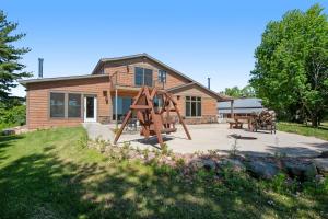 a house with a playground in front of it at The Lodge on Glen in Douglas Center