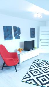 TV a/nebo společenská místnost v ubytování 2 Schlafzimmerwohnung bei Frankfurt am Main