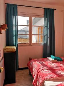 Cama ou camas em um quarto em Hostal Vitalia