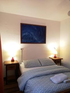 Cama ou camas em um quarto em Hostal Vitalia