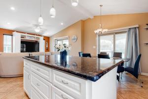 a kitchen and dining room with a large counter top at Long Island Village 502 Clam in Port Isabel