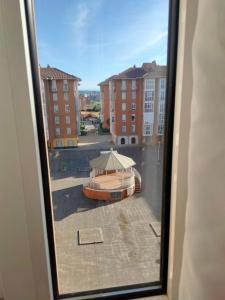 a view from a window of a building with a playground at GRAN FAMILIA in Santander