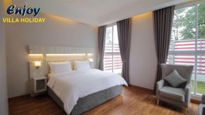Giường trong phòng chung tại Alulu Luxury Residence - One Bedroom Apartment
