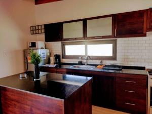 a kitchen with a sink and a counter top at UCOGUESTHOUSE - Casa de Huéspedes in Vista Flores