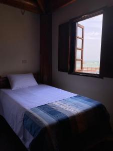 Postel nebo postele na pokoji v ubytování Jin Sha Ting Hai Homestay I