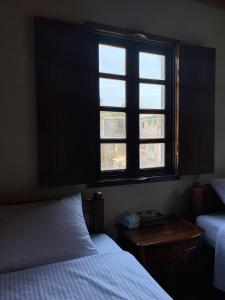Postel nebo postele na pokoji v ubytování Jin Sha Ting Hai Homestay I