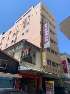 a tall building with writing on the side of it at Traveler Hotel Taitung in Taitung City