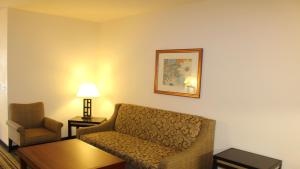 a living room with a couch and a chair at Holiday Inn Express Berkeley, an IHG Hotel in Berkeley