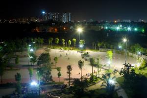 a park at night with trees and lights at Green Line Long Bien - Serviced Apartment - Ngoc Thuy - Hanoi in Hanoi