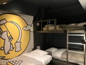 Postel nebo postele na pokoji v ubytování HOTEL TAVINOS Kyoto