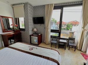 Postel nebo postele na pokoji v ubytování Ngo House Villa
