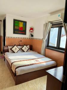 Postel nebo postele na pokoji v ubytování Ngo House Villa