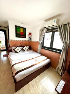 Postel nebo postele na pokoji v ubytování Ngo House Villa