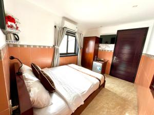 Postel nebo postele na pokoji v ubytování Ngo House Villa