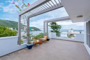 a balcony with a view of the water at Palm Villa 39 - Luxury Free Bida & Karaoke in Vung Tau
