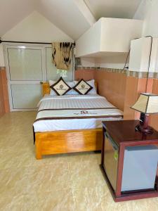 Postel nebo postele na pokoji v ubytování Ngo House Villa