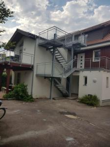 a building with stairs on the side of it at Lamm - Wohnung 4 in Spiegelberg
