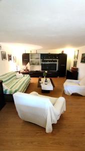 a living room with two beds and a couch at Holiday Home Jaga in Biograd na Moru