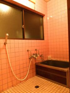 A bathroom at Aoshima Guesthouse Hooju