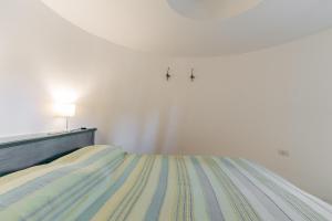 A bed or beds in a room at La Pajara de la Urpe