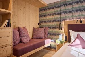 Postel nebo postele na pokoji v ubytování Dolomit Boutique Hotel