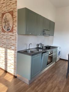 A kitchen or kitchenette at Casa Azzurra